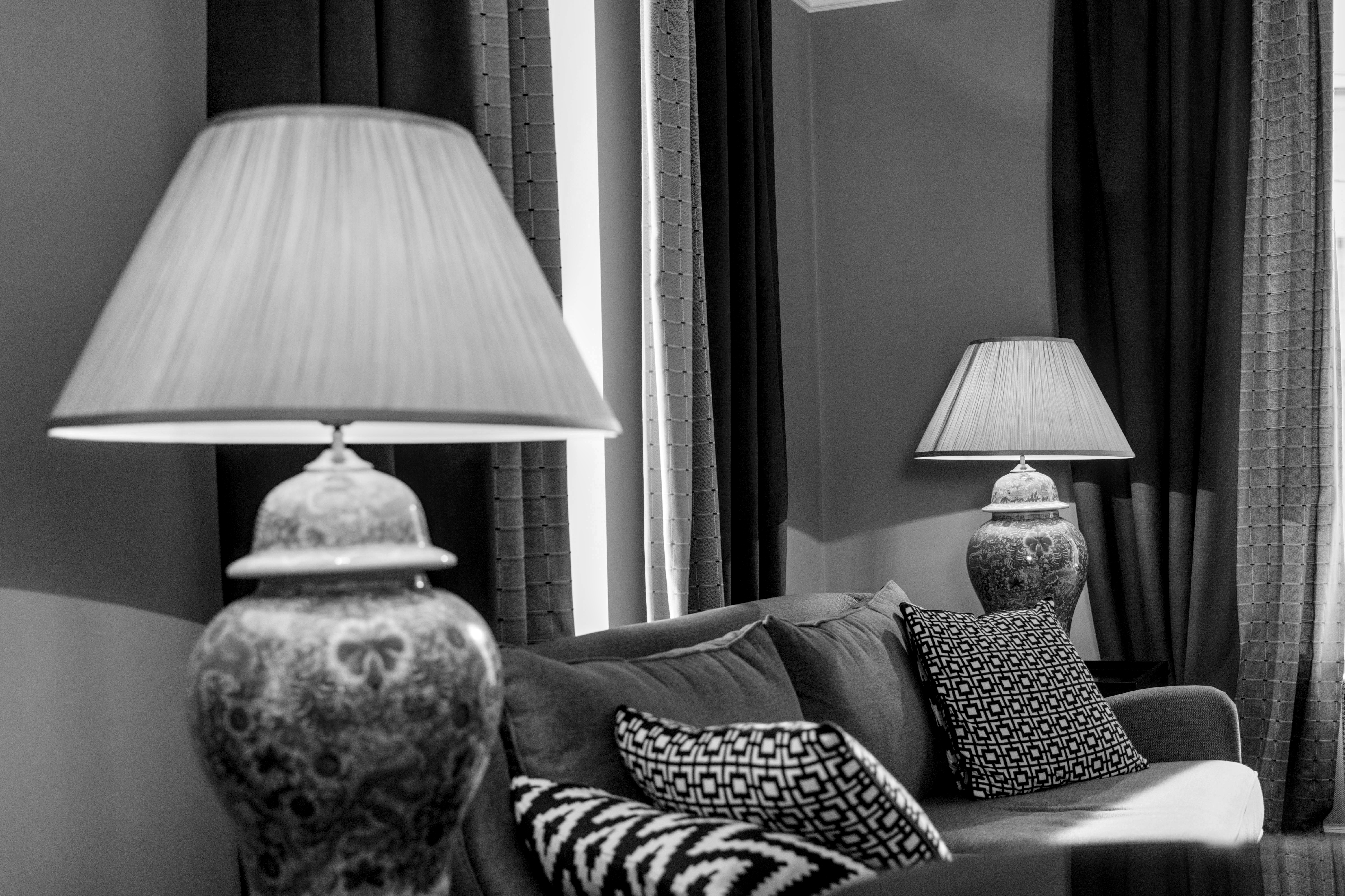 A well-appointed living room with curated furnishings and lighting.